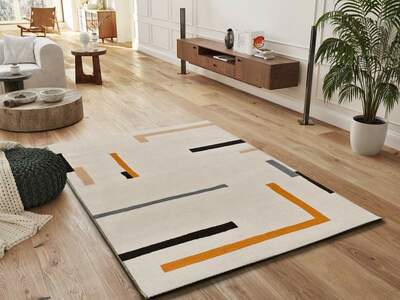 ALFOMBRA GEOMÉTRICA LESSIA LÍNEA NARANJA Y NEGRO